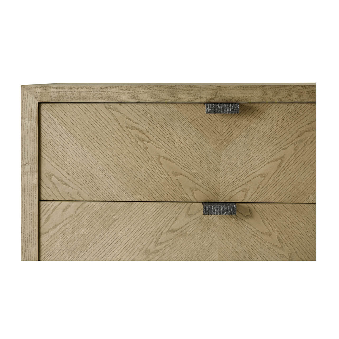 Close-up of top drawers and handles on chest.