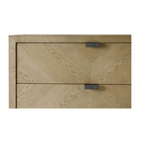 Close-up of top drawers and handles on chest.