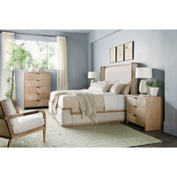 Bedroom with tall chest and matching decor.