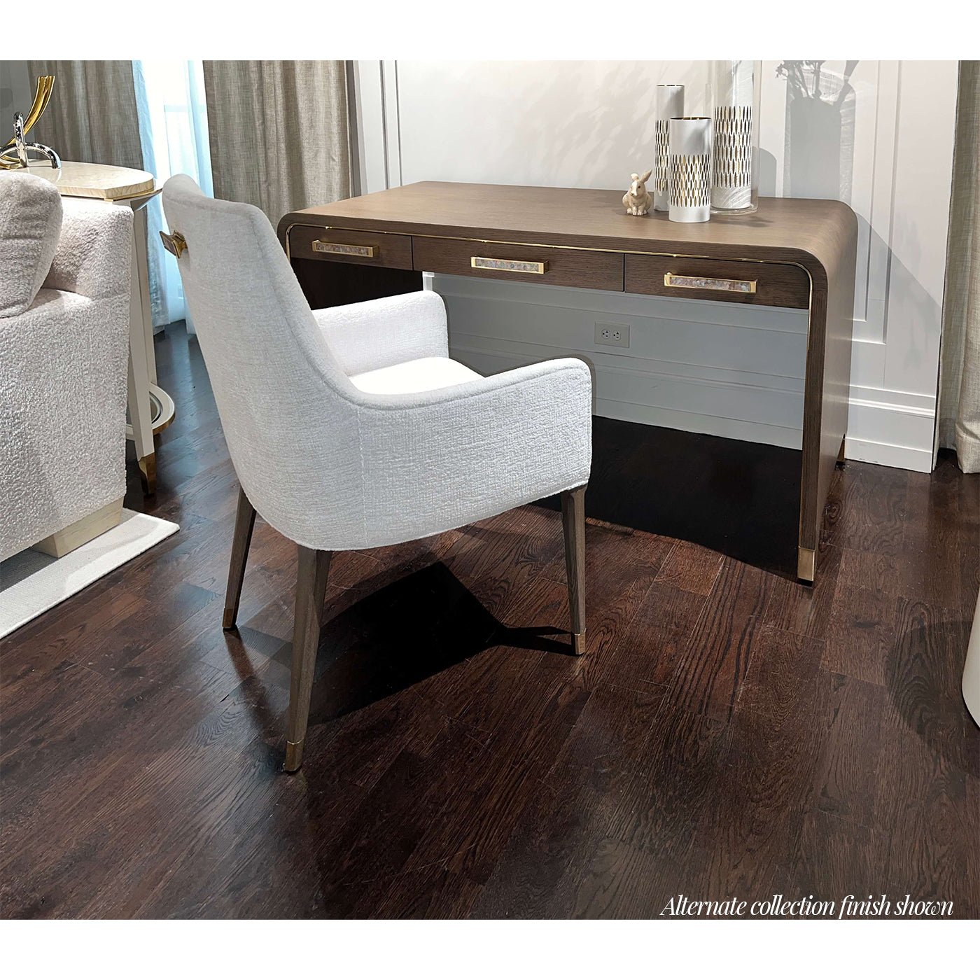 Light Hollywood Regency desk with chair in stylish room setting.