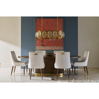Dining room setting with upholstered armchairs around table.