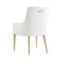 White upholstered armchair, rear view showcasing back detail.