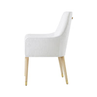 Side profile of white upholstered armchair with wooden legs.