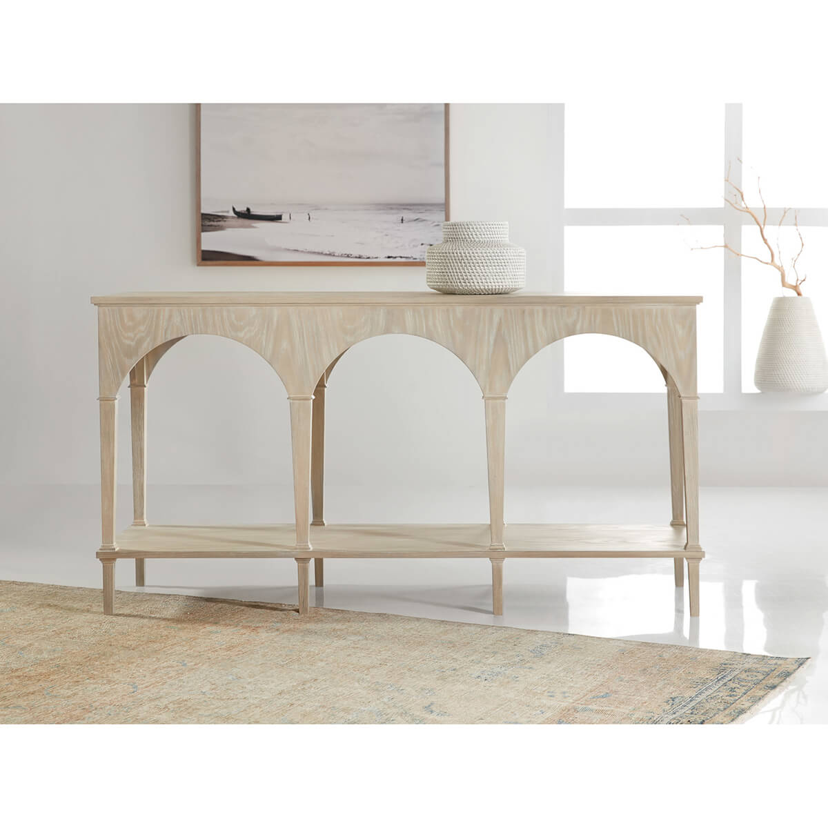 Console table in bright room with decorative accents.