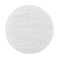 Overhead view of round dining table's white surface.
