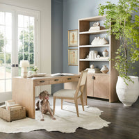 Dining chair at desk in modern home office setup.