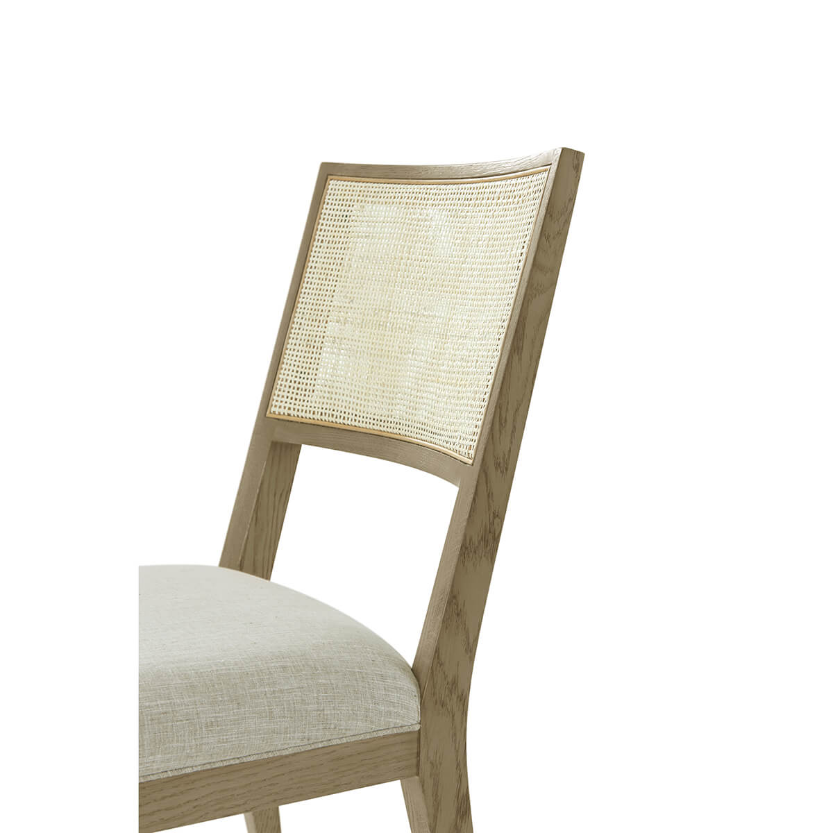 Close-up of dining chair back, cane detail highlighted.
