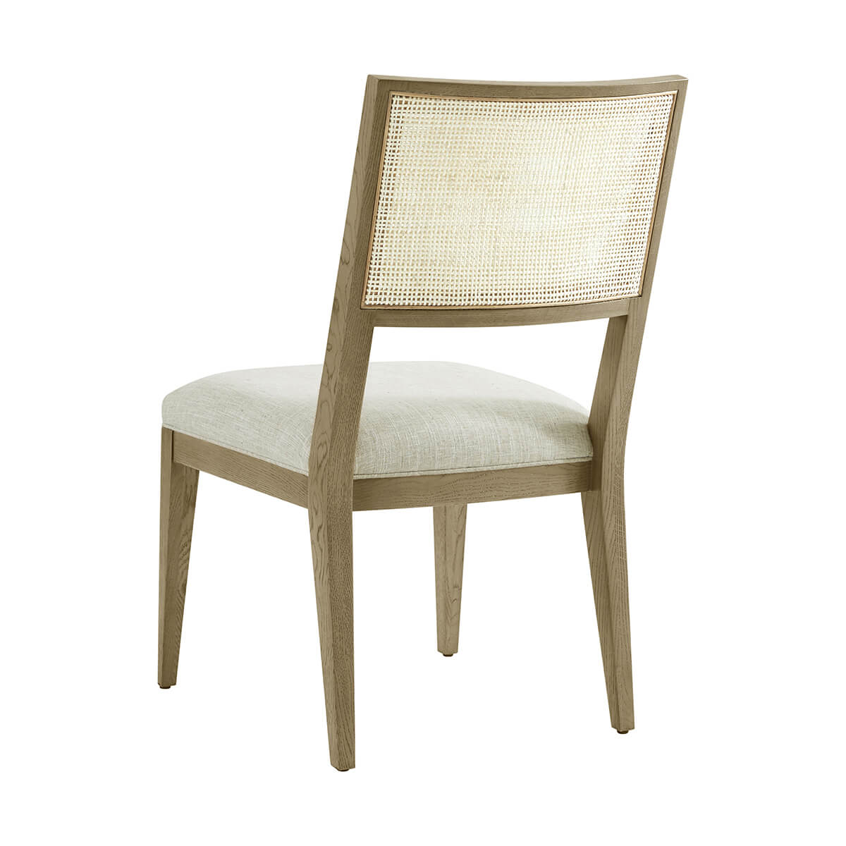 Light oak dining chair back view showing cane detail.