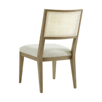 Light oak dining chair back view showing cane detail.