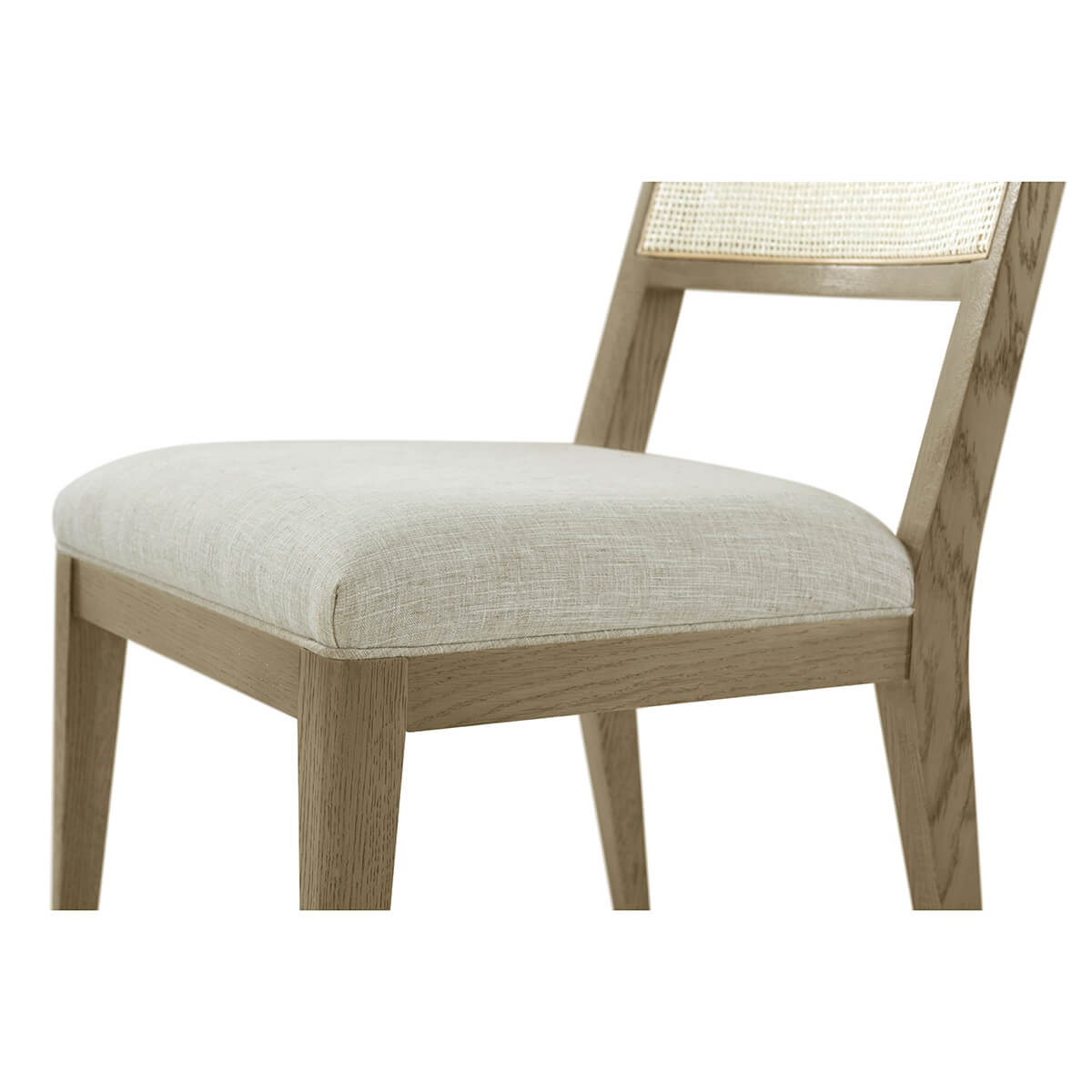 Close-up of dining chair cushion and frame construction.