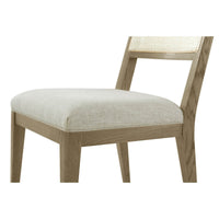Close-up of dining chair cushion and frame construction.