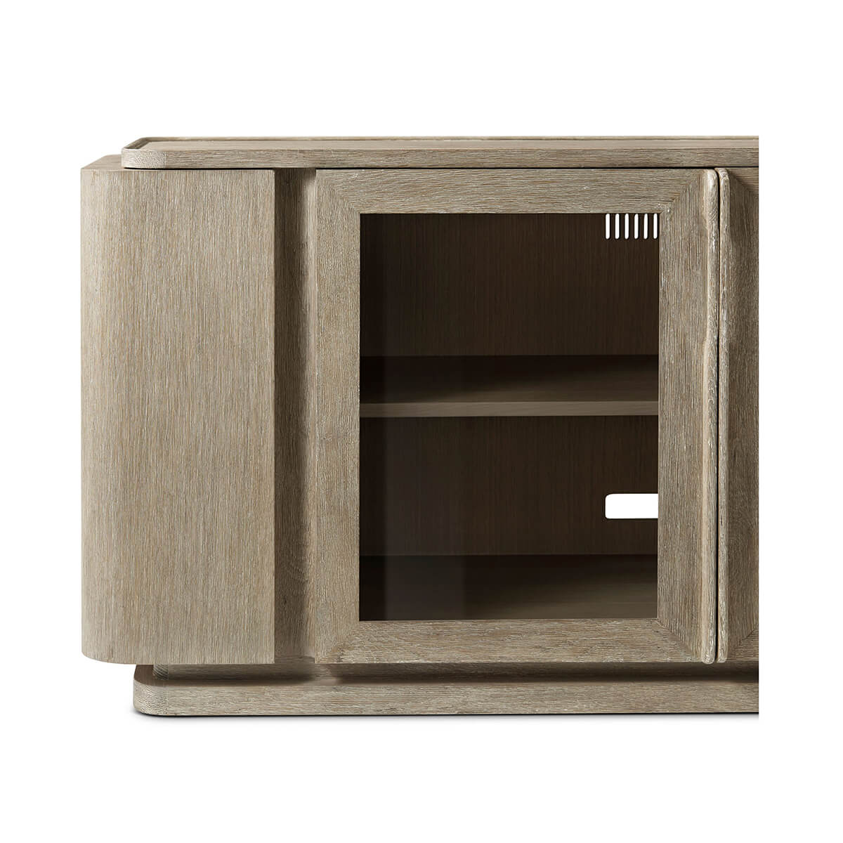 Close-up corner of oak media console with glass door.