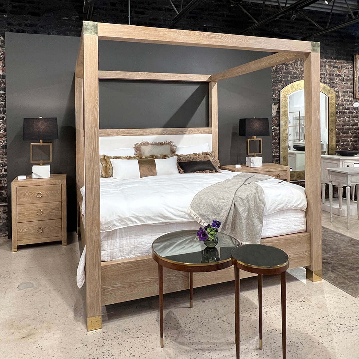 Bedroom set with bedside chest and canopy bed.