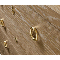 Close-up of gold handles on bedside chest.