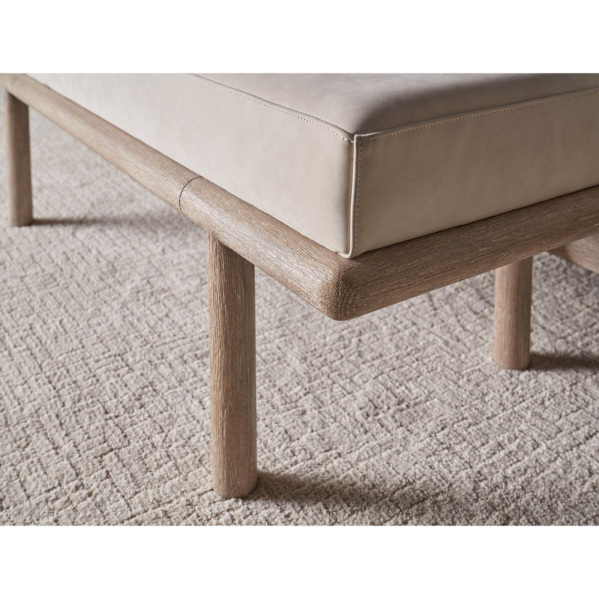 Modern bench, close-up of wood frame and cushion texture.