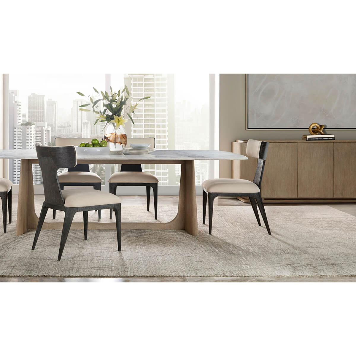 Dining room setup with light oak modern buffet sideboard.