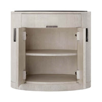Light oak oval nightstand, open showing shelves inside.