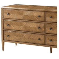 Dresser showing detailed parquetry design and handles.
