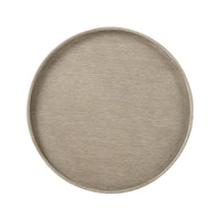 Top view of light oak round side table surface.