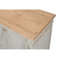 Close-up of wooden top of gray antique buffet.
