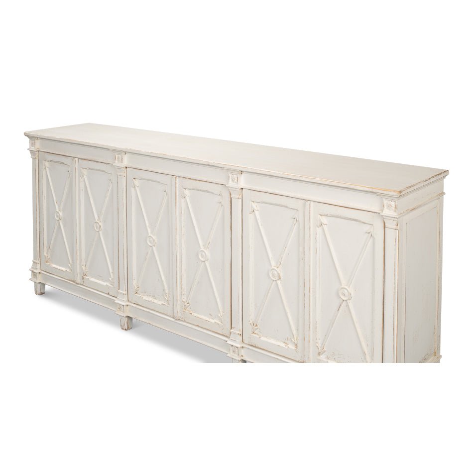 Close-up angled view of white buffet, x-detail doors.