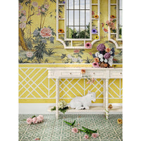 Console table styled with flowers and mirrored wall.