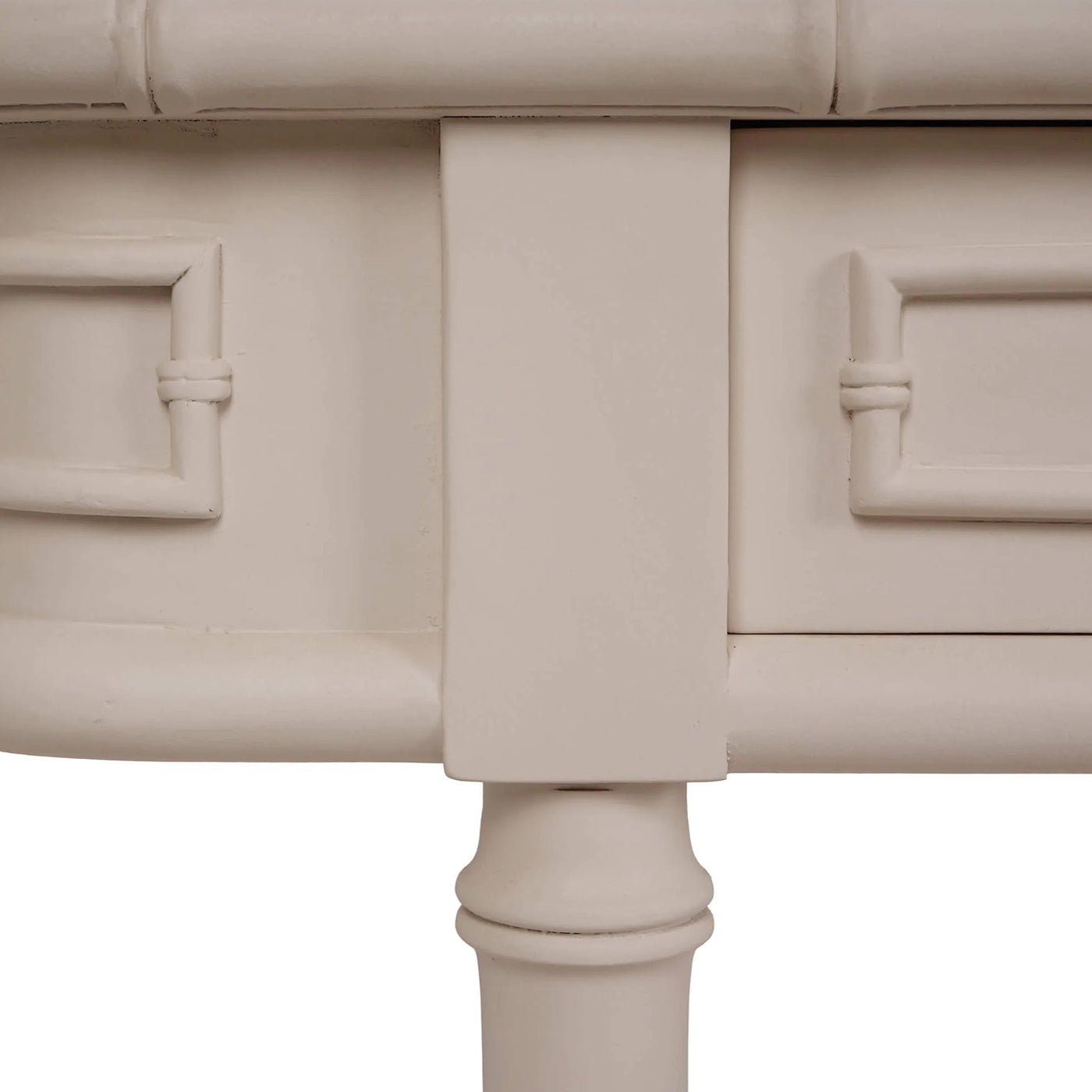 Detailed view of console table corner design.
