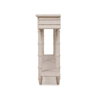 Side view of faux bamboo console table legs.