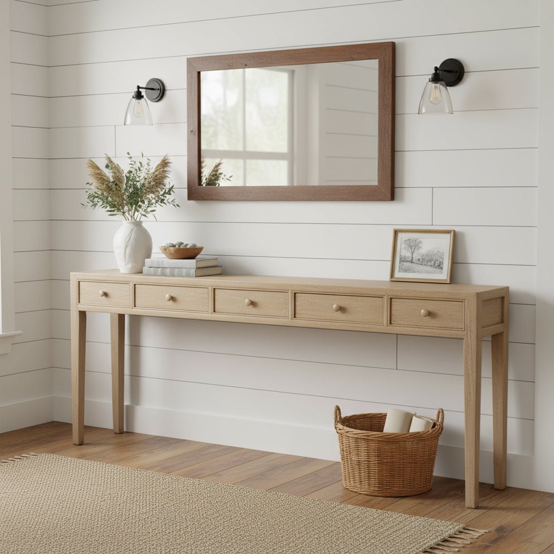 Console table styled in a room, under mirror.