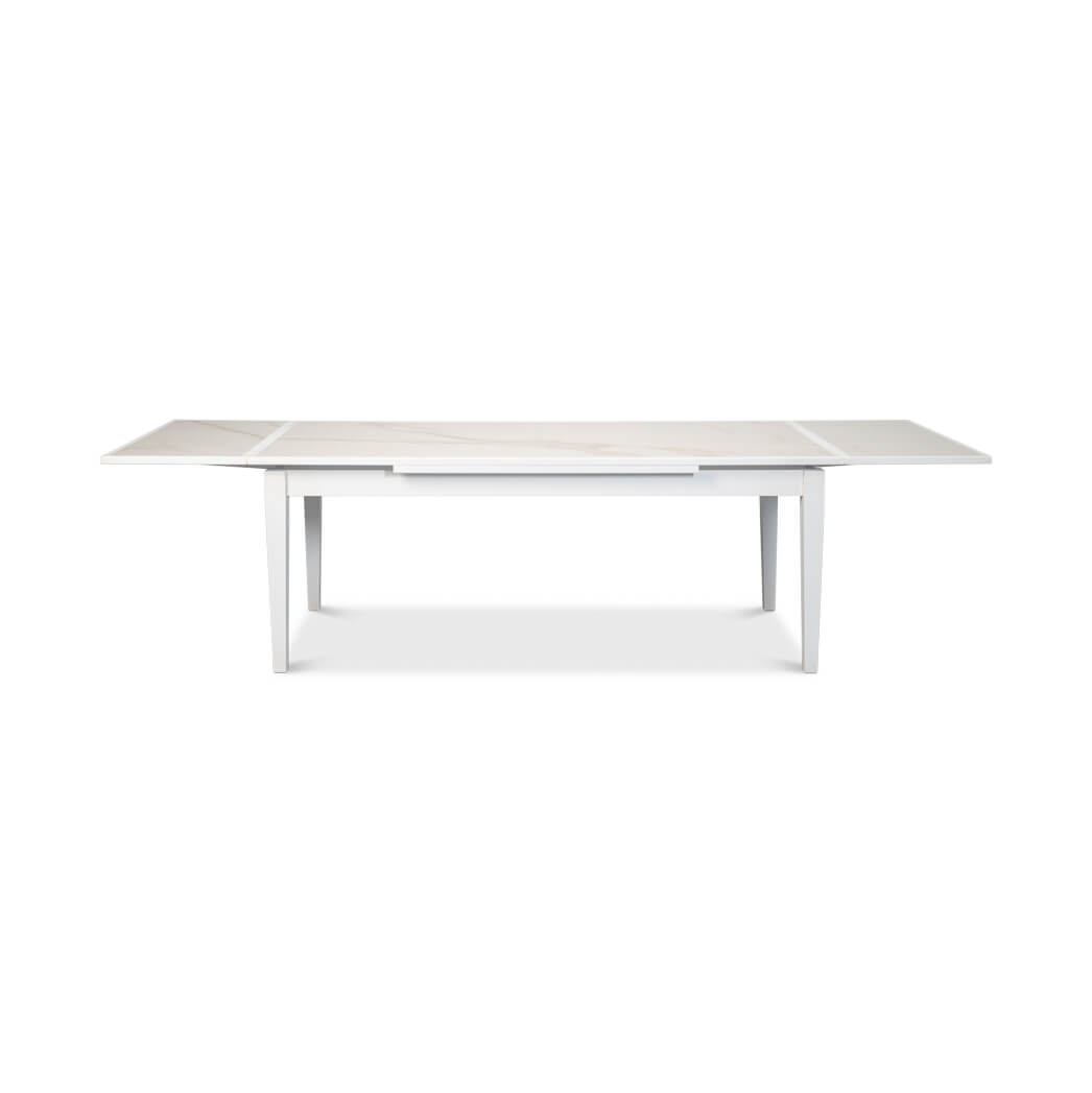 Fully extended white Italian dining table, front view.
