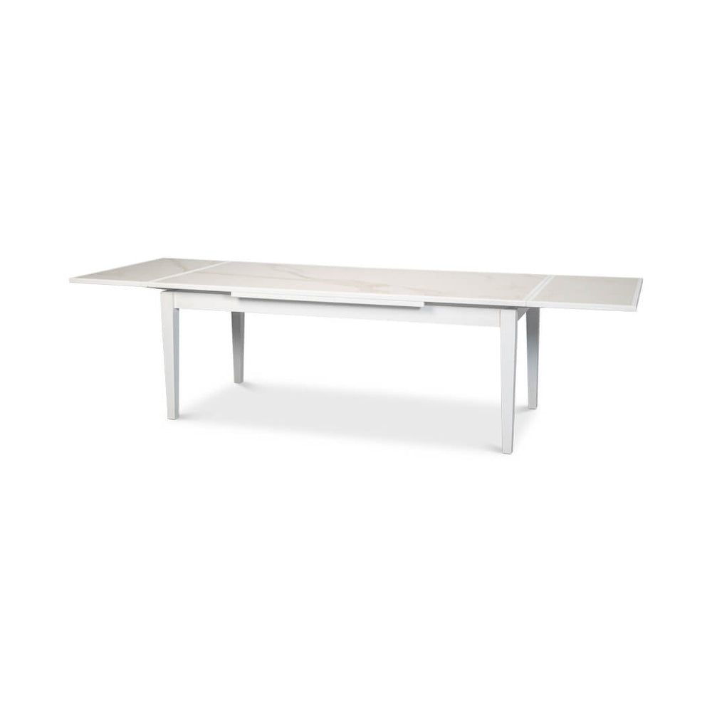 Extended white Italian draw leaf dining table, side view.