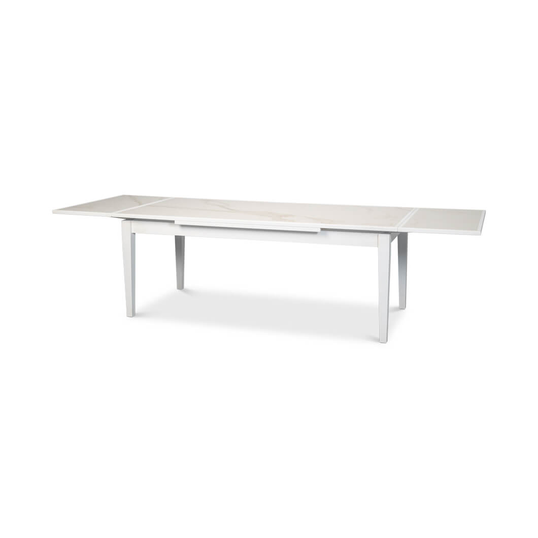 Extended white Italian draw leaf dining table, side view.