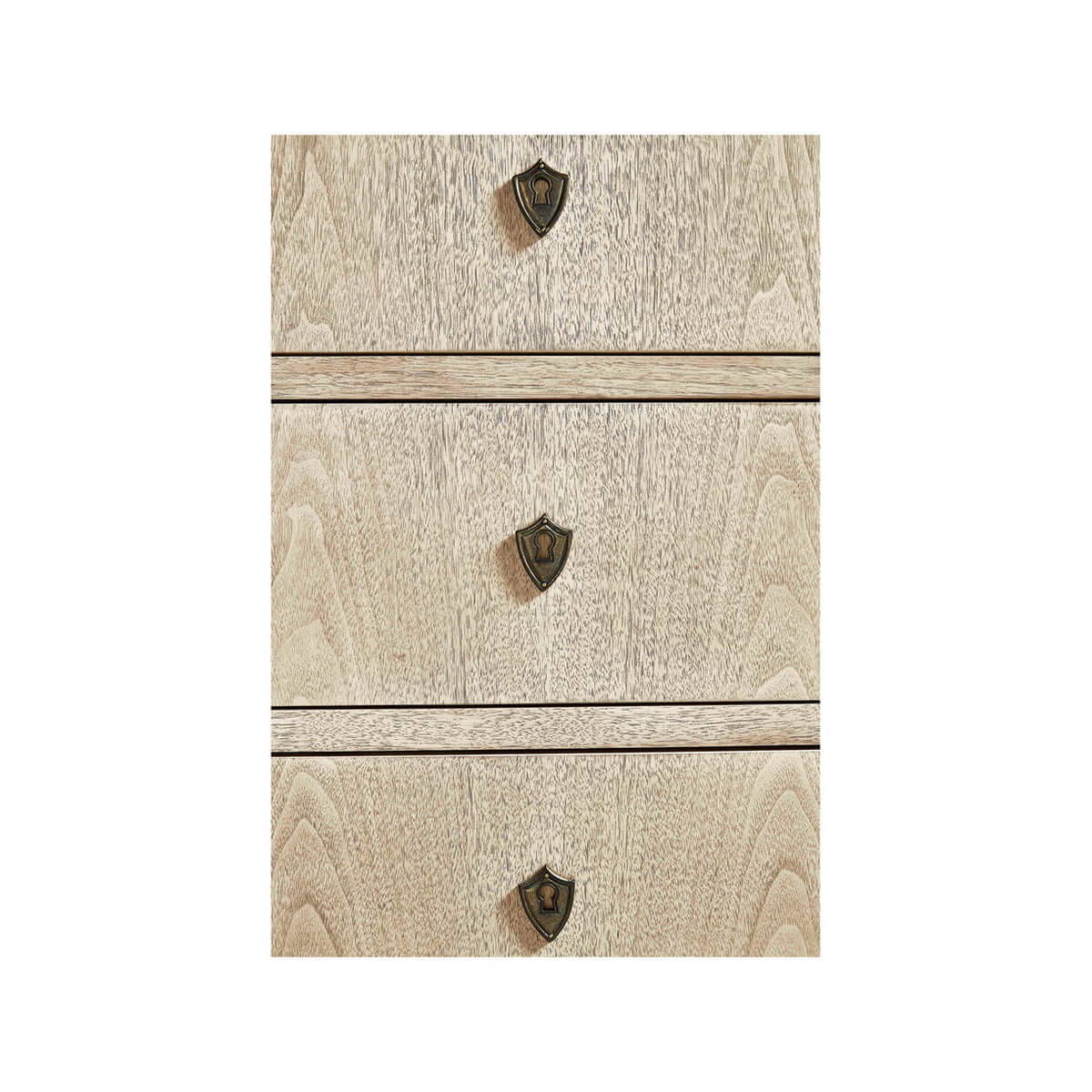 Close-up of drawer handles on wooden dresser, detailed texture.
