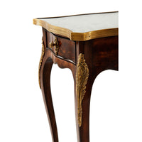 Close-up of ornate leg design on side table