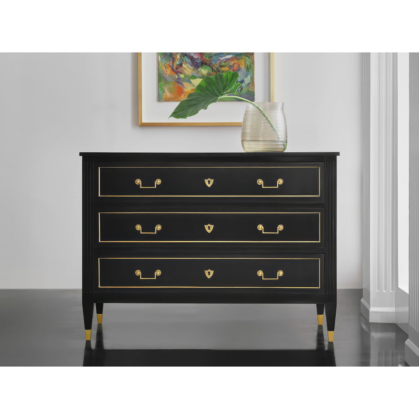 Louis XVI black dresser in stylish room setting.