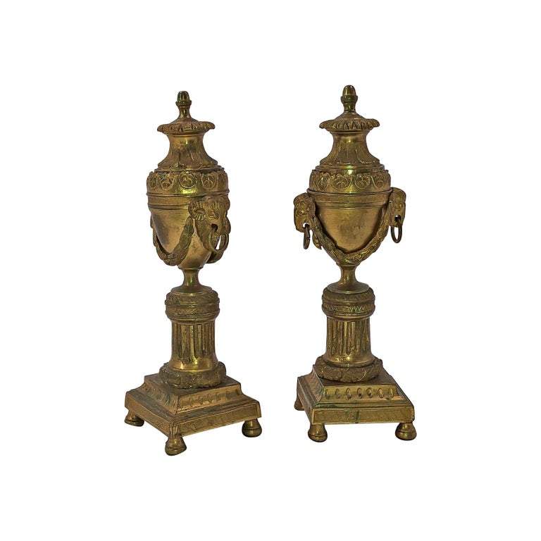 Pair of bronze Louis XVI-style cassolletes candelabra front view.