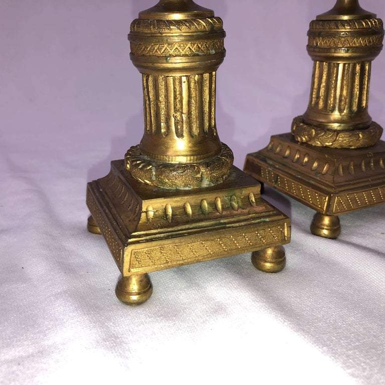 Base detail of bronze Louis XVI-style candelabra.