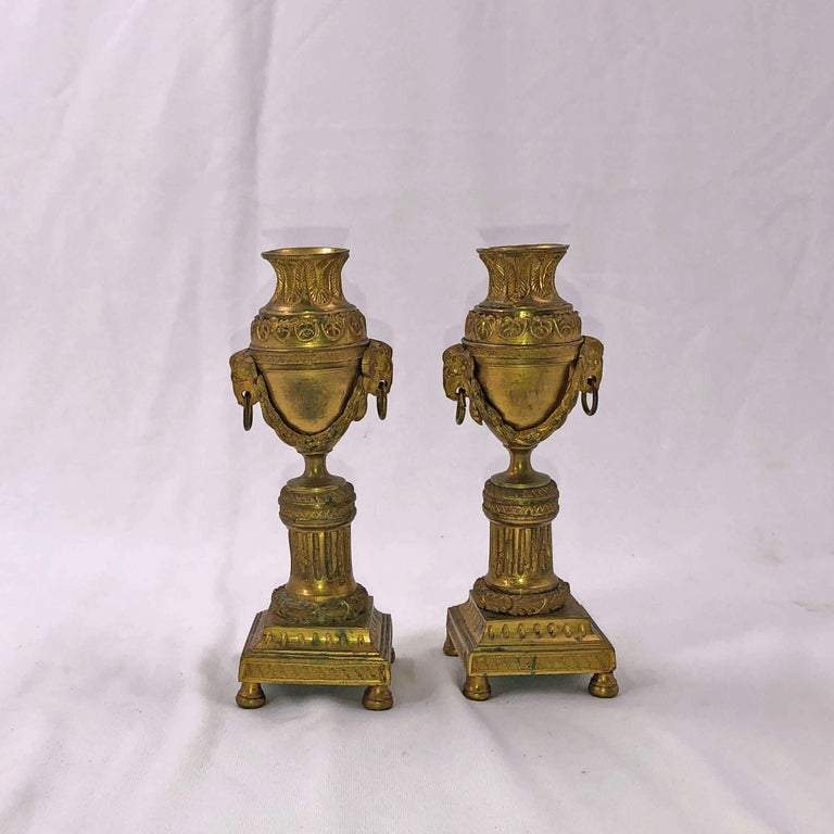 Front view of two bronze Louis XVI candelabra.