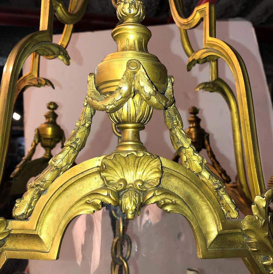 Decorative top ornamentation on bronze hall lantern.