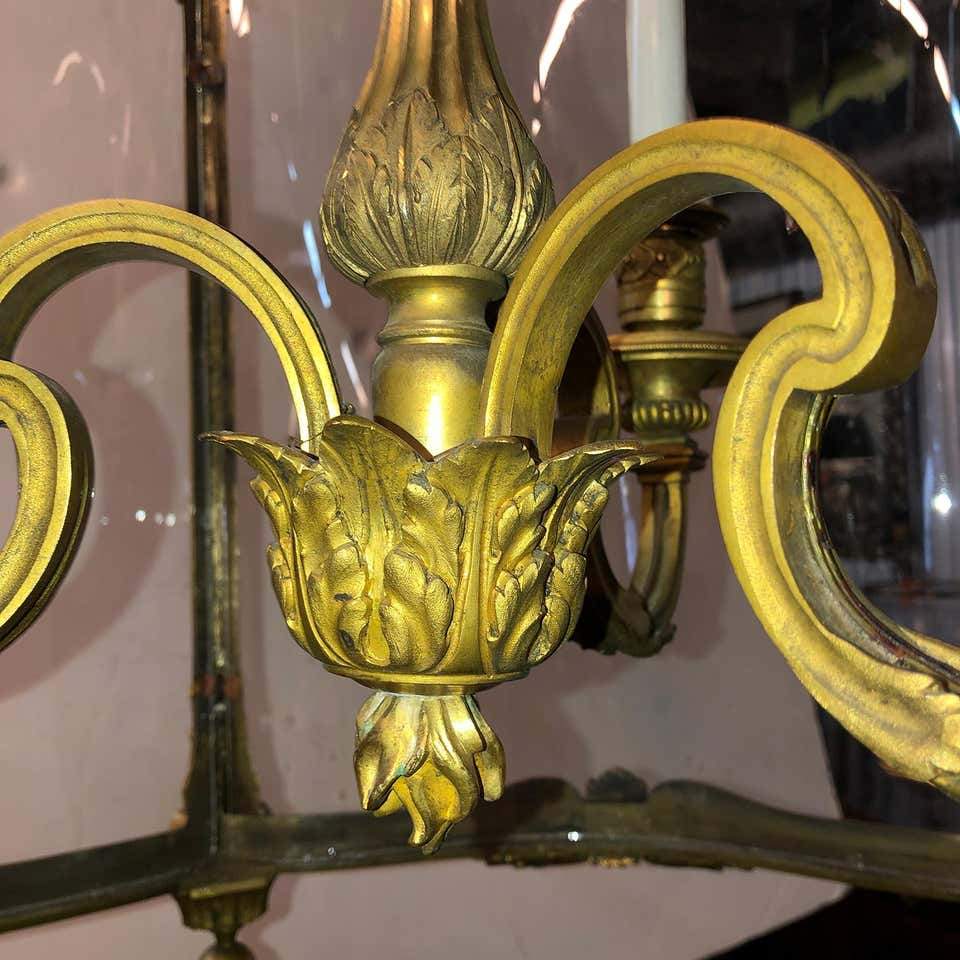 Scrollwork design on bronze hall lantern candelabra.
