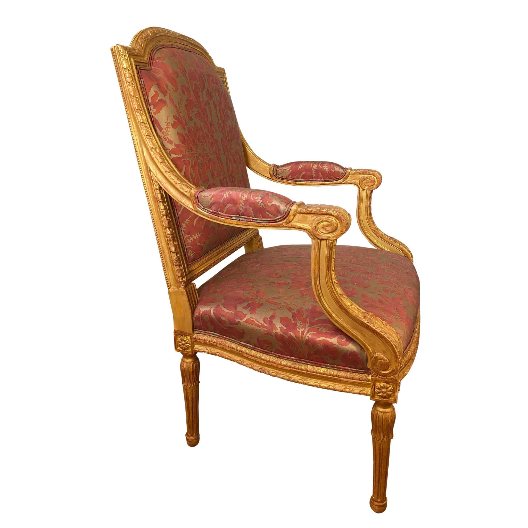 Side angle of Louis XVI fauteuil with carved giltwood.