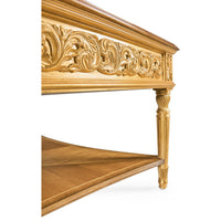 Detailed side view of coffee table carvings and leg.