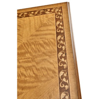Close-up of coffee table border with decorative scrollwork.