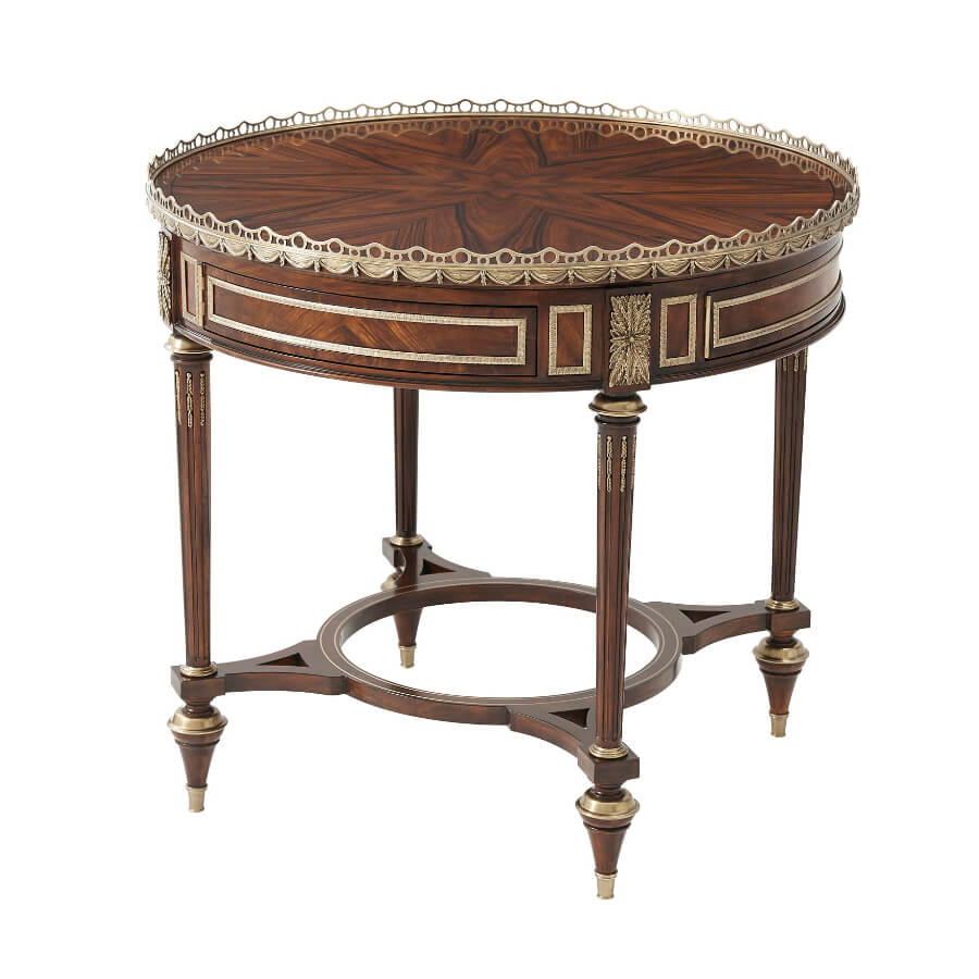 Louis XVI mahogany center table with ornate design.