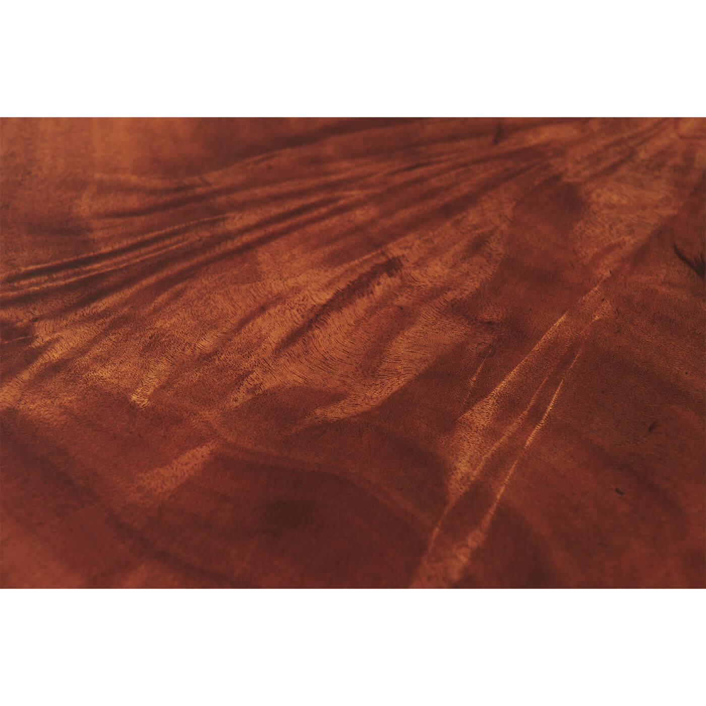 Mahogany wood grain texture on end table surface.