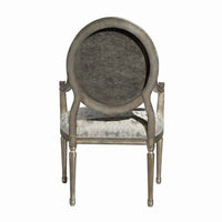 Louis XVI armchair back view, damask upholstery feature.