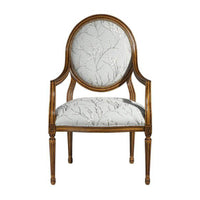 Louis XVI armchair front view, floral upholstery detail.