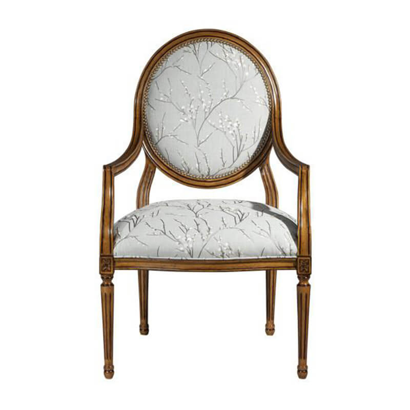 Louis XVI armchair front view, floral upholstery detail.