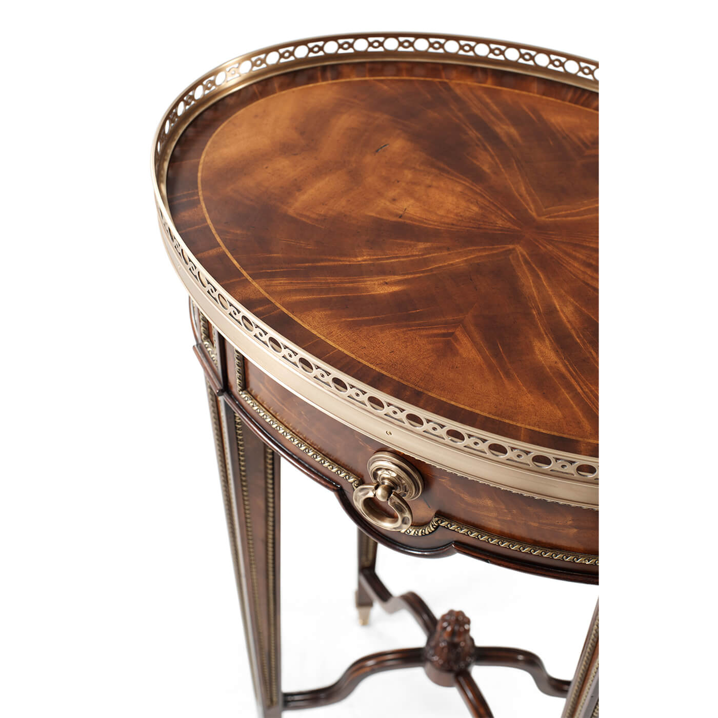 Oval end table, close-up, brass trim and detail.