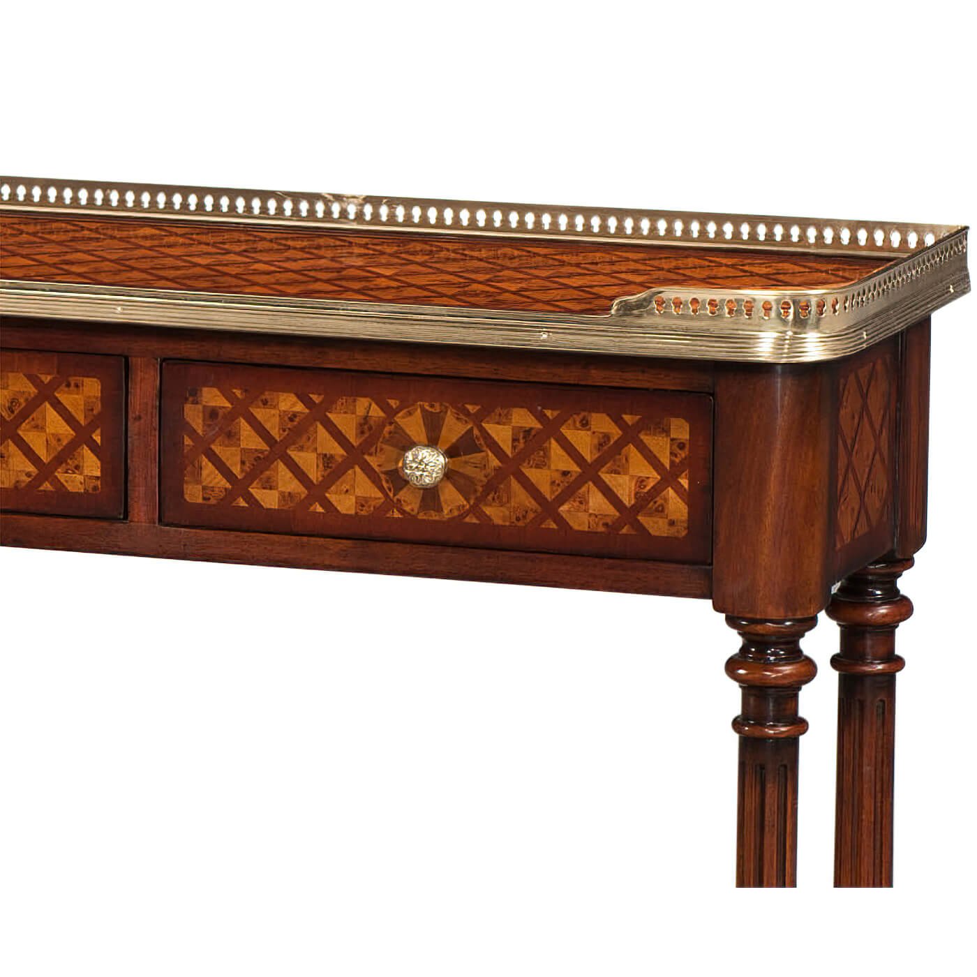 Close-up of drawer with parquetry design and ornate trim.